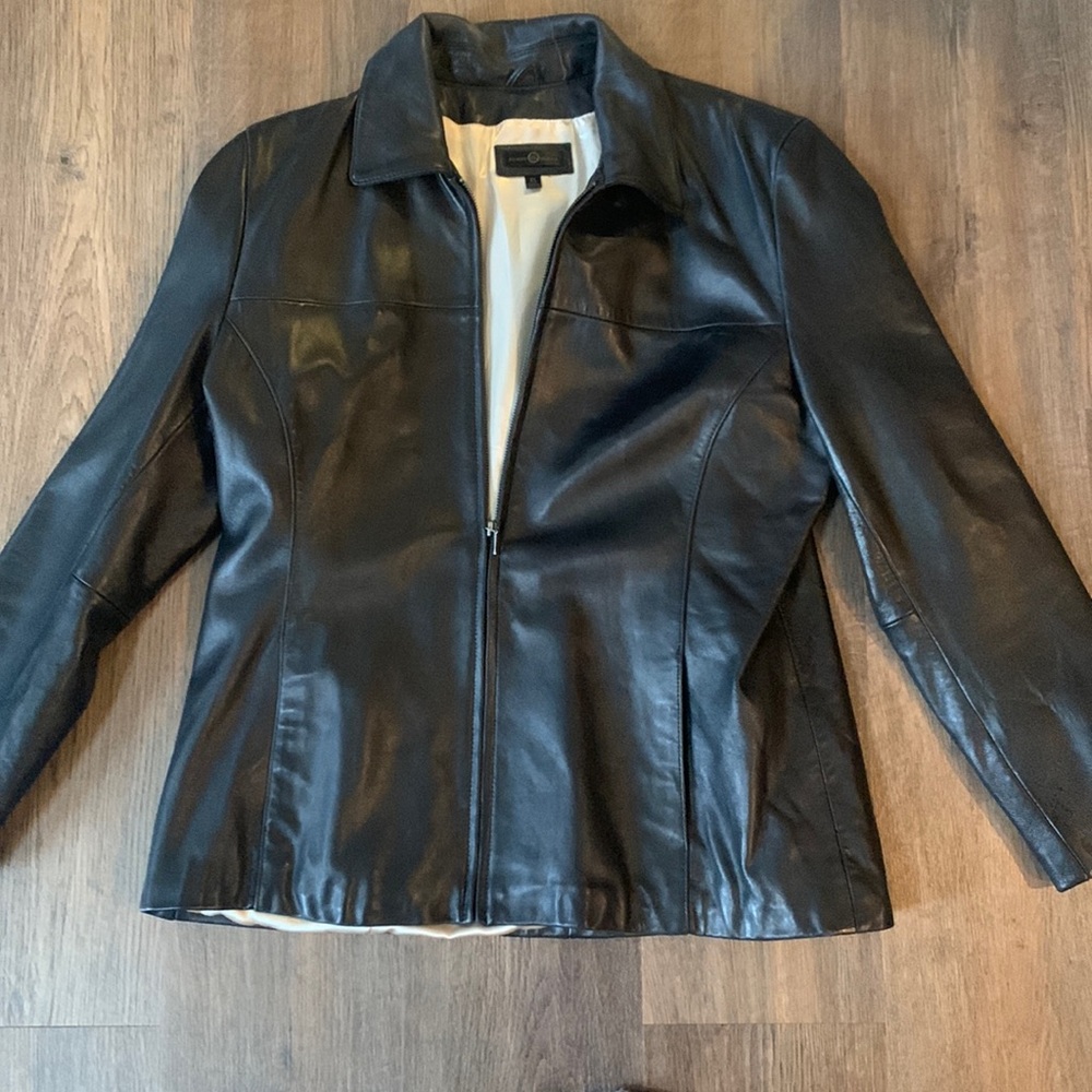 Wilson’s black leather jacket size. XL